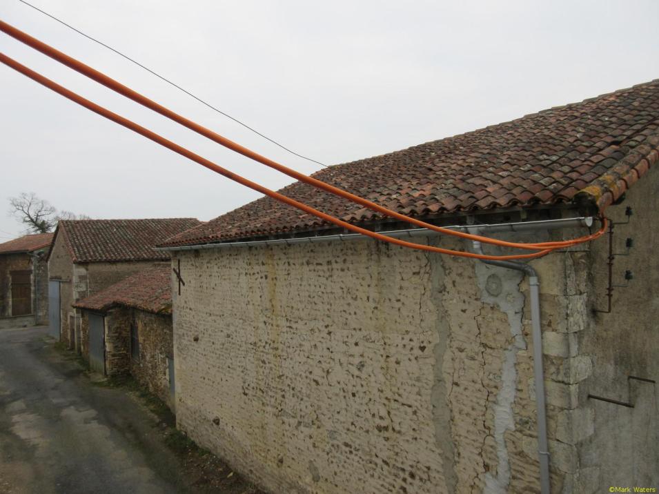 Unsupported conduit between the buildings